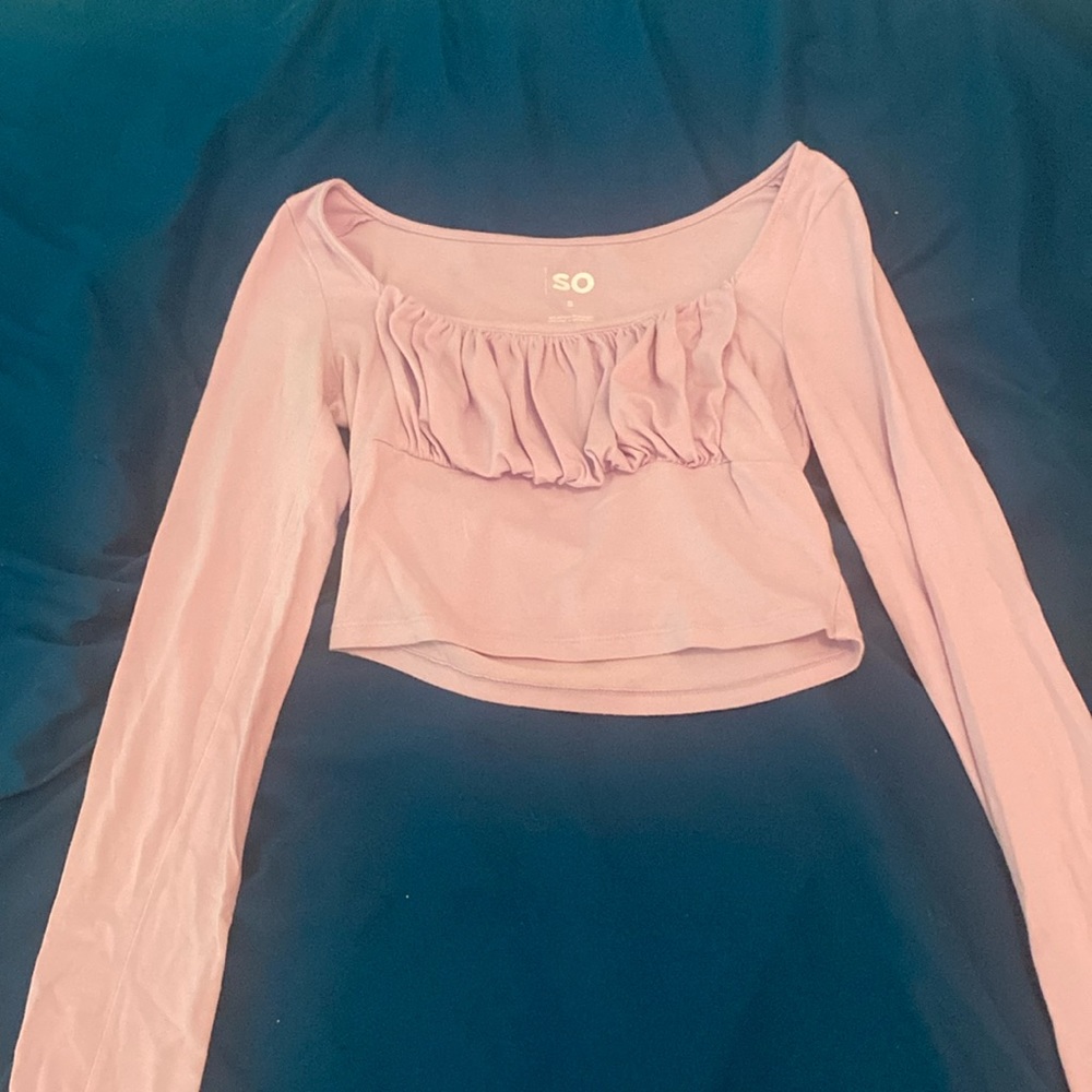 A purple king sleeve with a ruffle in the front